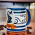 SUBLIMART: Palio di Siena Porcelain printed mug - Capri Blue Handle & Rim - Design by Mario Bruno - ONDA (Dolphin)