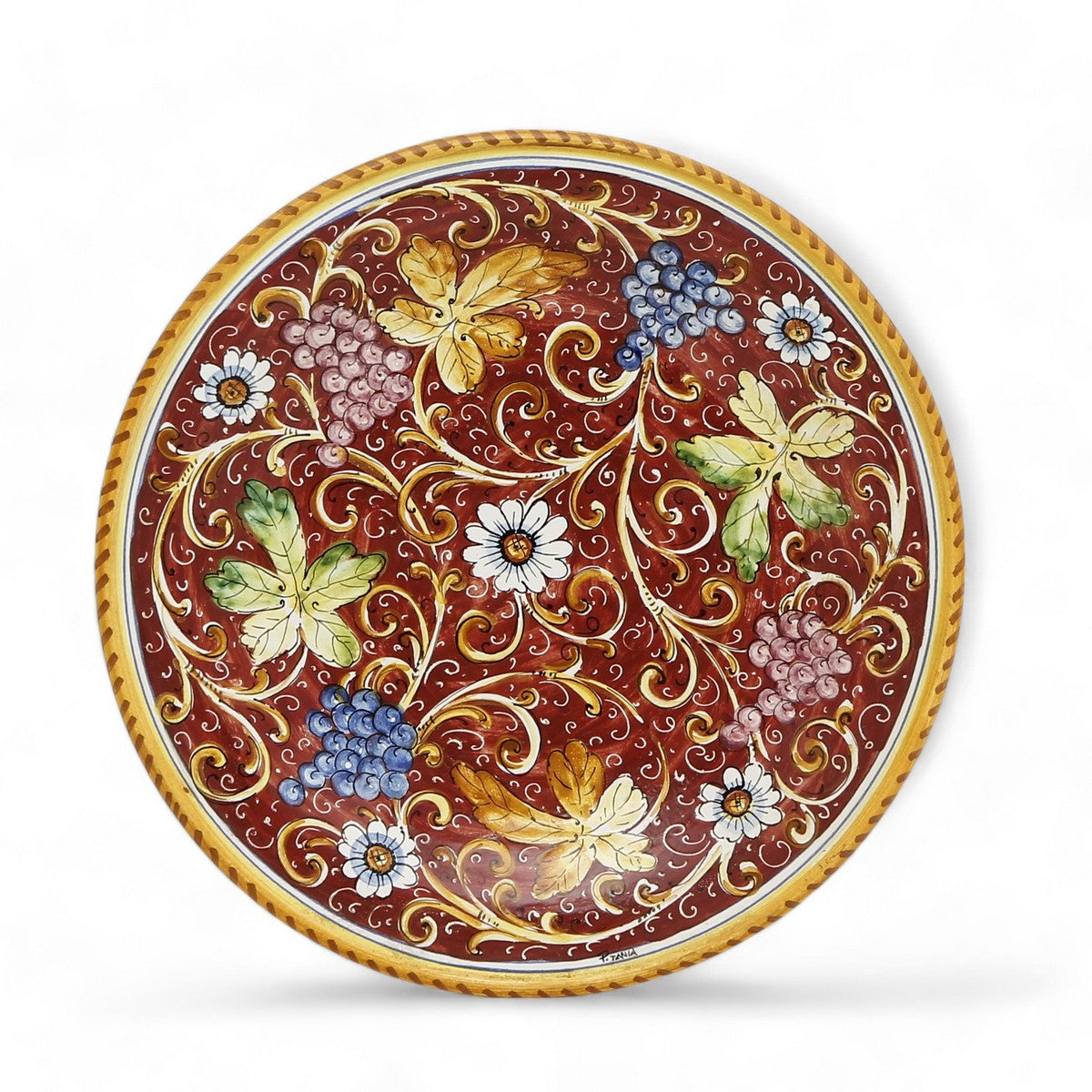 TUSCAN MAJOLICA: Medium wall plate featuring grapes and flowers on a Burgundy Red background (14.5&quot; DIAM)